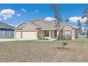 One story home with three-car garage and partial stone facade at 4313 Sw 106Th Pl, Ocala, FL 34476