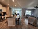 Open kitchen features an island and granite countertops at 9118 Sw 62Nd Terrace, Ocala, FL 34476