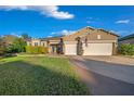 Beautiful two-story house with a three-car garage and manicured lawn at 9146 Sw 65Th Loop, Ocala, FL 34481