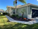 Charming one-story home with landscaped front yard and attached garage at 9586 70Th Sw Loop, Ocala, FL 34481