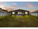 Newly built home featuring a spacious backyard with a large covered patio at 187 Hickory Course Trce, Ocala, FL 34472