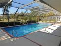 Inviting screened pool with brick coping and a spa at 3282 Sw 9Th Ave, Ocala, FL 34471