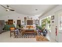 Bright living room with eclectic decor, comfy seating, and large windows at 15330 Sw 59Th Ct, Ocala, FL 34473