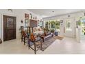 Eclectic living room with hardwood floors, unique furniture, and access to the kitchen at 15330 Sw 59Th Ct, Ocala, FL 34473