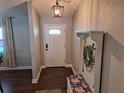 Inviting entryway with hardwood floors and a charming bench at 17 Pecan Crse Dr, Ocala, FL 34472