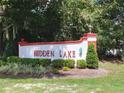 Hidden Lake community entrance sign with landscaping at 7703 Sw 103Rd Loop, Ocala, FL 34476