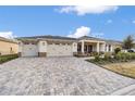 Two-car garage and a large paved driveway at 9725 Sw 108Th Terrace Rd, Ocala, FL 34481