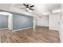 Spacious living room featuring wood-look flooring and neutral wall colors at 11743 Sw 72Nd Cir, Ocala, FL 34476