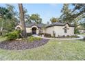 This charming house features a walkway and lush landscaping at 363 Sw 48Th Ln, Ocala, FL 34471