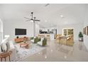 Bright living room with open floor plan, featuring a stylish sitting area and dining space at 41 Oak Run, Ocala, FL 34472