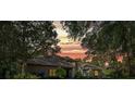 Stunning home exterior at sunset with warm lighting and beautiful landscaping at 5004 Se 5Th Ave, Ocala, FL 34480