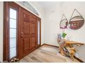 Interior entry featuring a wooden door and a unique console table at 3803 Se 6Th Ave, Ocala, FL 34480