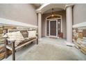 Front entry with stone accents and a rustic bench at 3803 Se 6Th Ave, Ocala, FL 34480