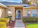 Welcoming front entry with covered porch and decorative walkway at 8327 Sw 79Th Cir, Ocala, FL 34476