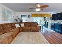 Spacious living room with comfortable sectional sofa and wood floors at 8327 Sw 79Th Cir, Ocala, FL 34476
