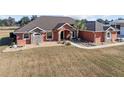 One-story home with tile roof, stone accents, and a large yard at 9901 Nw 6Th Ct, Ocala, FL 34475