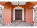 Inviting entryway with double doors and stone accents at 9901 Nw 6Th Ct, Ocala, FL 34475