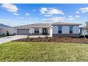 One-story house with gray accents and a two-car garage at 8444 Sw 99Th Ave, Ocala, FL 34481