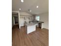 Modern kitchen featuring an island and granite countertops at 3496 Sw 149Th Ct, Ocala, FL 34481