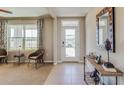 Inviting foyer with natural light, tiled floor, and a stylish console table at 7188 Se 113Th Ln, Belleview, FL 34420