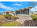 Spacious screened patio with pavers and lush landscaping at 7932 Sw 89Th Cir, Ocala, FL 34481