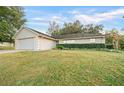 Inviting one-story home with a two-car garage and landscaped front yard at 3980 Se 24Th St, Ocala, FL 34471