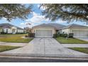 One-story home with a double garage and neatly landscaped yard at 7102 Sw 91St Ct, Ocala, FL 34481