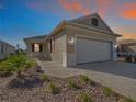 Attractive one-story house with garage, showcasing sunset view at 7883 Sw 89Th Cir, Ocala, FL 34481