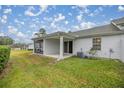 Screened patio with grassy backyard and AC unit at 2505 Se 18Th Cir, Ocala, FL 34471