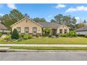 Single-story home with stone accents and landscaped yard at 3907 Se 10Th Ave, Ocala, FL 34480