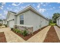 Spacious living room with orange couch and large TV at 5237 Nw 48Th Pl, Ocala, FL 34482