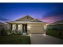 Attractive one-story home at dusk with landscaping at 6243 Sw 89Th Street Rd, Ocala, FL 34476