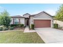 One-story house with a two-car garage and well-manicured lawn at 6622 Sw 97Th Terrace Rd, Ocala, FL 34481