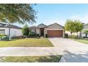 House exterior showcasing a driveway and front yard at 6622 Sw 97Th Terrace Rd, Ocala, FL 34481