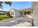 Spacious front patio with a decorative star design at 2427 Due West Dr, The Villages, FL 32162