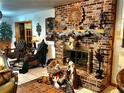 Brick fireplace with a mantle, creating a cozy focal point in the living area at 10502 Se 29Th Ave, Ocala, FL 34480