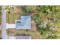 Aerial view of single Gathering home with gray roof and driveway at 5310 Nw 61St Ln, Ocala, FL 34482