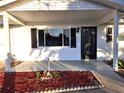 Front view of a charming house with a covered porch at 11179 Sw 78Th Ct, Ocala, FL 34476