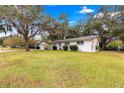 House with a large yard and mature trees at 1249 Se 18Th St, Ocala, FL 34471