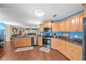 Open concept kitchen with stainless steel appliances at 2201 Nw 135Th Ln, Citra, FL 32113