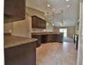 Open concept kitchen with ample counter space and dark wood cabinets at 5230 Nw 56Th Ter, Ocala, FL 34482