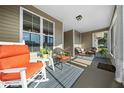 Bright and airy porch with rocking chairs, perfect for relaxing at 10804 Sw 81St Court Rd, Ocala, FL 34481