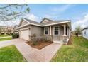 One-story home with stone accents and a welcoming front porch at 3977 Nw 46Th Ter, Ocala, FL 34482