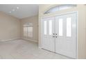 Bright entryway with double doors and tile flooring at 5370 Sw 85Th Ln, Ocala, FL 34476
