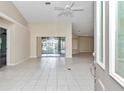 Spacious living room with tile floors and sliding glass doors to backyard at 5370 Sw 85Th Ln, Ocala, FL 34476