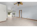 Open living area with tile floors and sliding glass doors to backyard at 11852 Se 71St Ct, Belleview, FL 34420