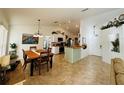 Open concept dining area with kitchen views and wood table at 15025 Sw 24Th Cir, Ocala, FL 34473