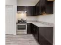 Modern kitchen featuring stainless steel appliances and granite countertops at 178 Pine Crse, Ocala, FL 34472