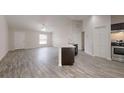 Open living area with vinyl plank flooring and kitchen island at 178 Pine Crse, Ocala, FL 34472