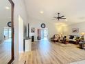 Spacious living room with laminate flooring, and a view to the back patio at 5032 Se 108Th St, Belleview, FL 34420